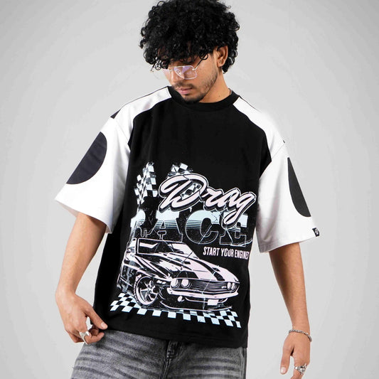 Model wearing black and white boxy fit t-shirt with car racing design by wibrnt